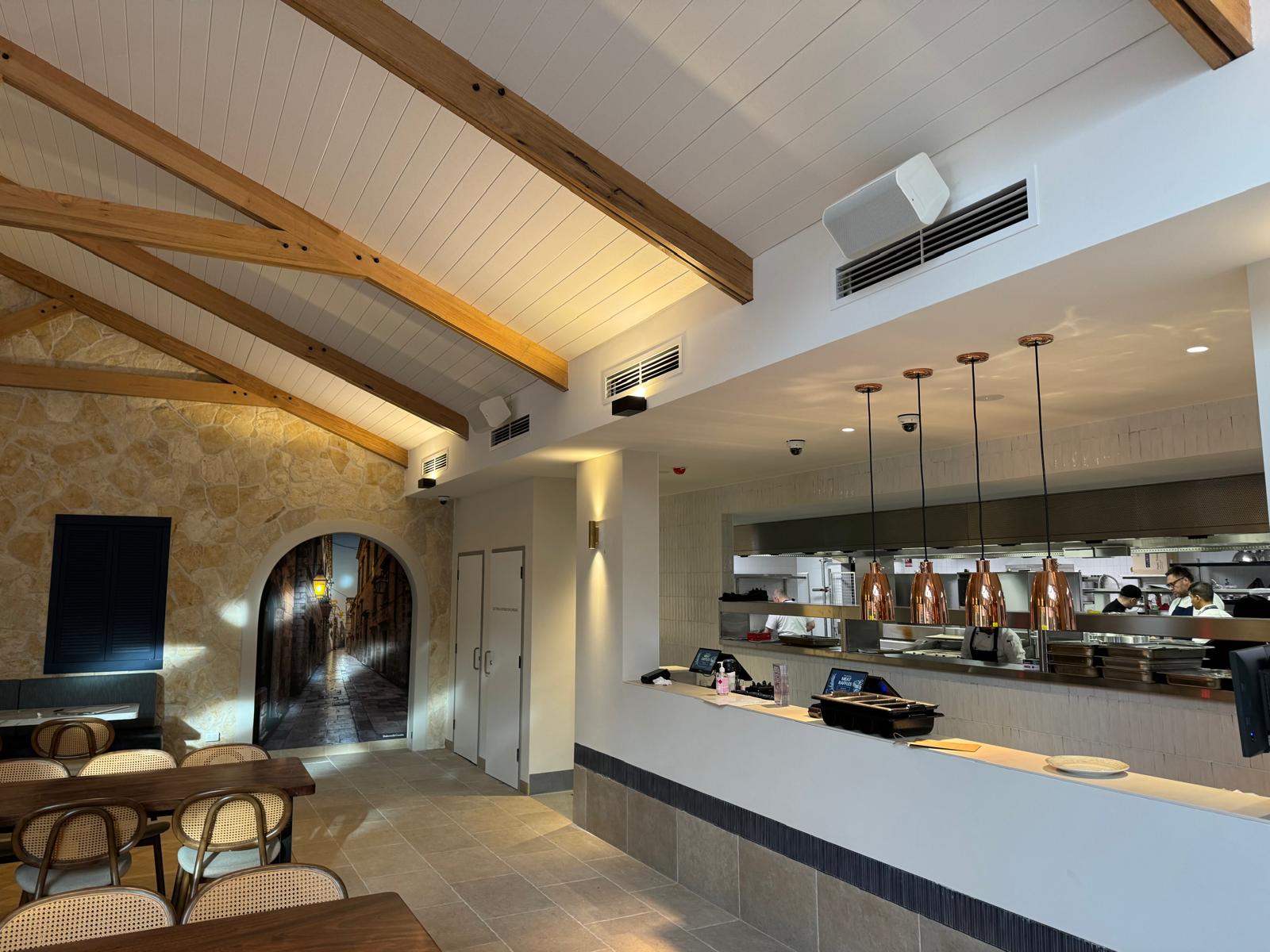 A finished box speaker installation, part of the venue-wide distributed audio system.