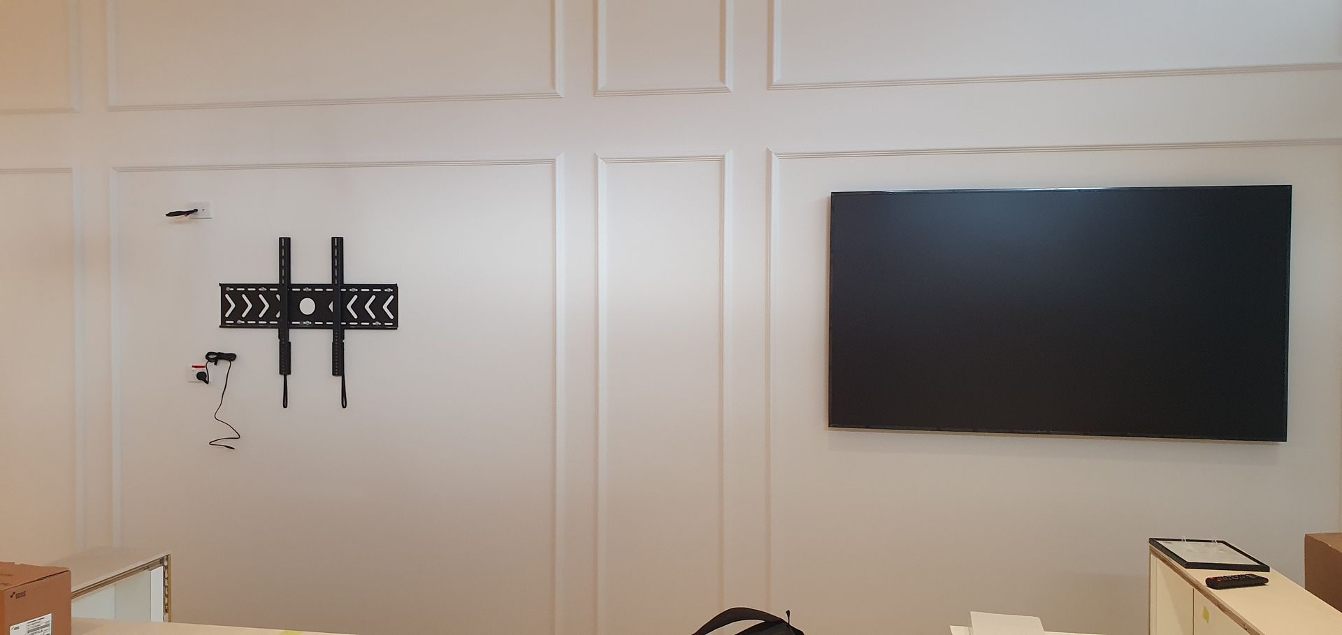 Installers mounting the entry displays that greet guests as they arrive at the venue.