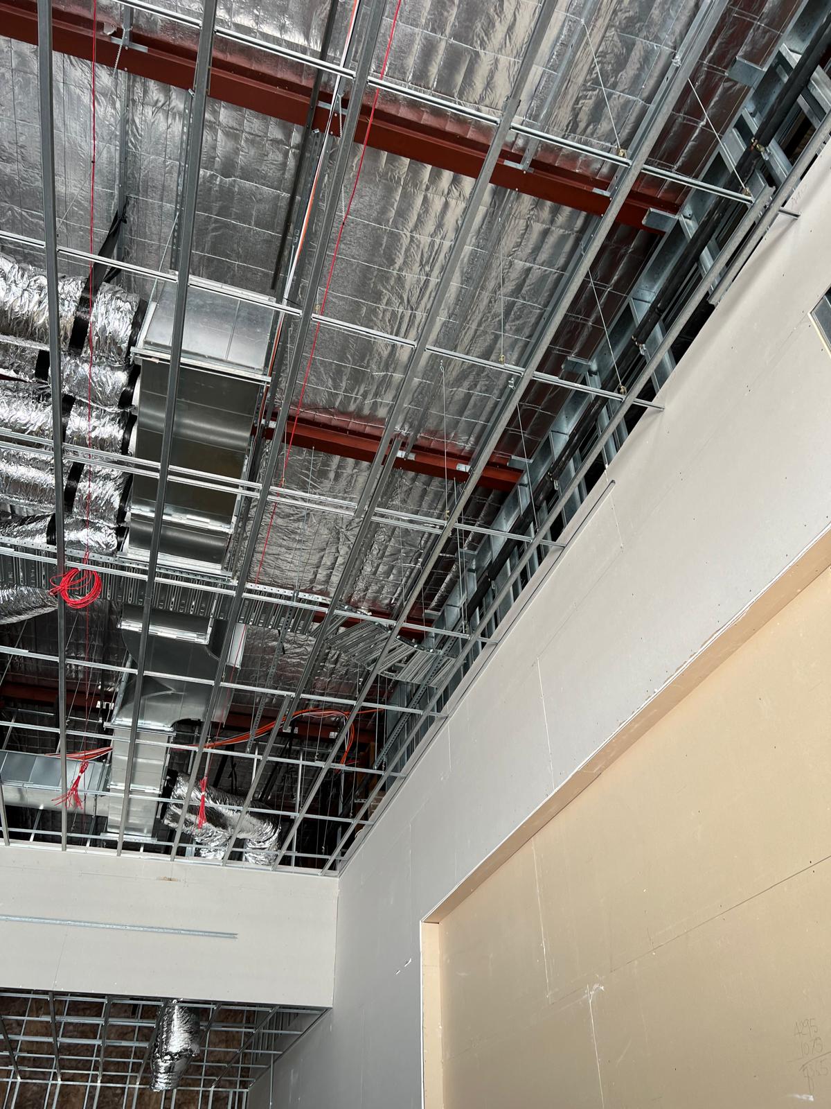 Exposed ceiling services and framing in the sports bar shell, well before the LED wall and finishes were installed.
