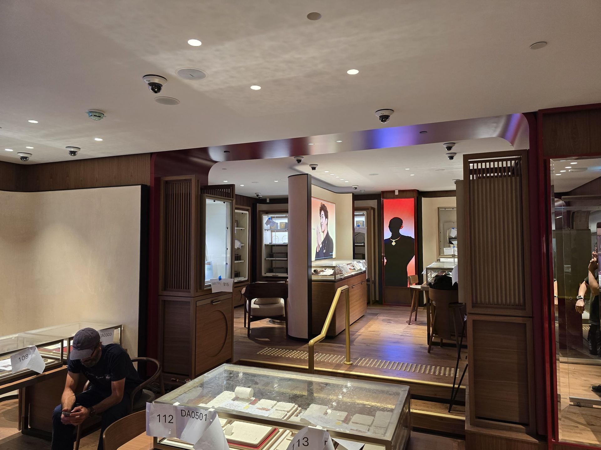 Completed retail environment showing the security camera system integrated discreetly throughout the finished ceiling and customer-facing space.