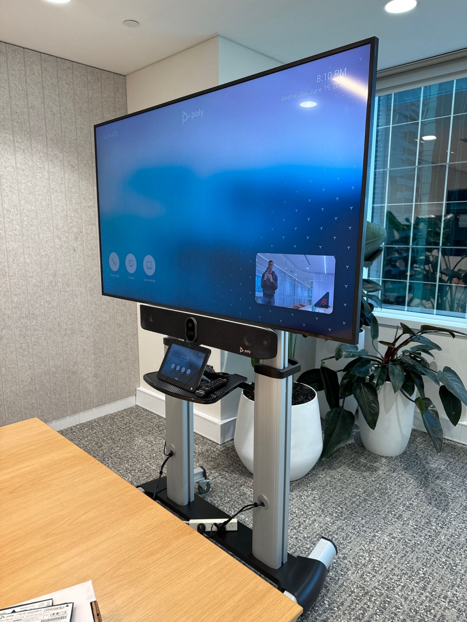 A video conferencing system on a mobile trolley, suited to spaces that need a flexible setup rather than a fixed installation.