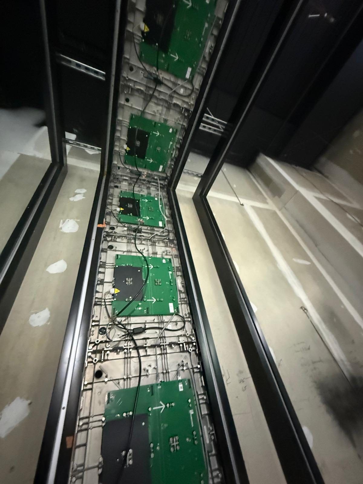 Rear view of individual LED display modules and driver boards, mounted in their aluminium support frame before the ceiling was closed in.
